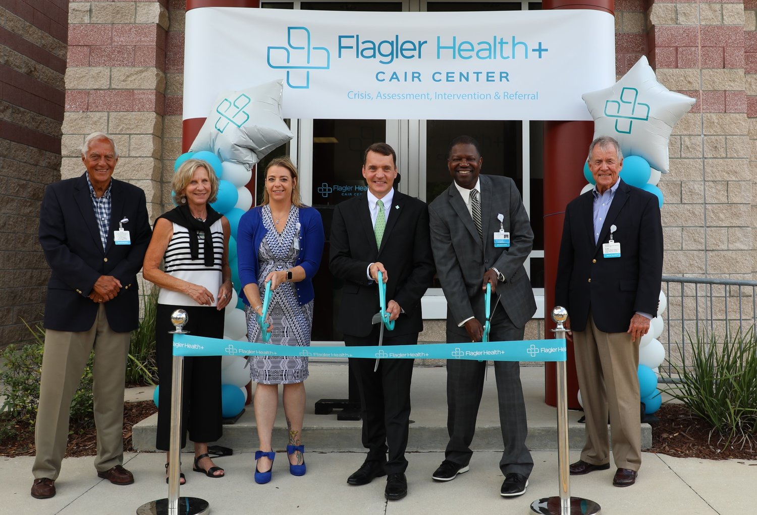 Flagler Health+ representatives cut the ribbon opening the new CAIR Center, which will provide access to, and coordination of, mental and behavioral health services.